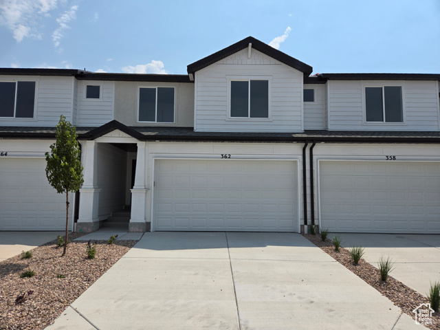 View of front of home featuring a garage