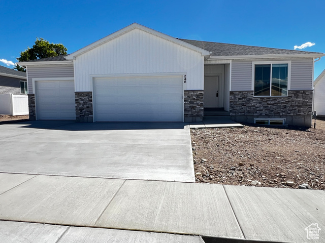 Ranch-style home featuring a garage