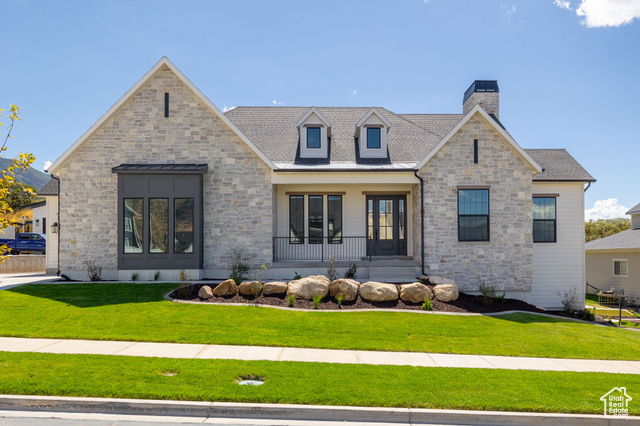 View of front of house with a front lawn