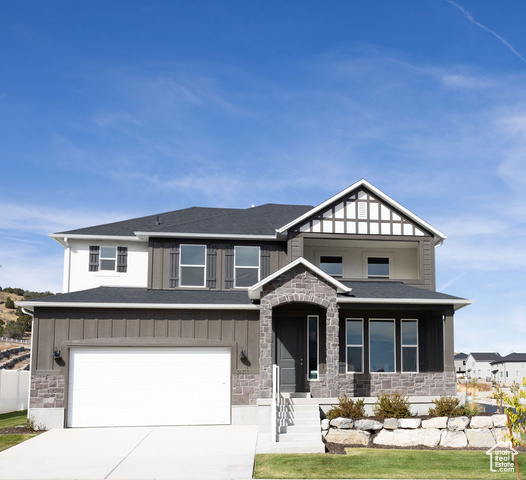 View of front of property with a garage