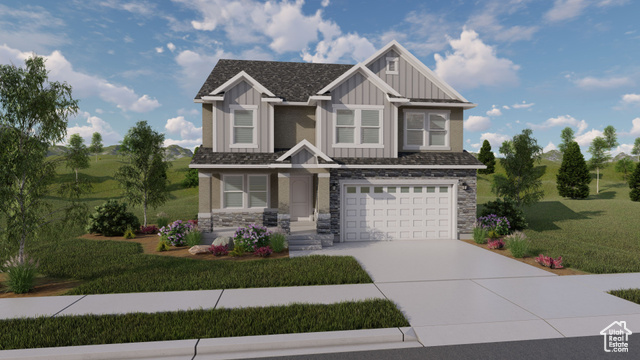 View of front facade with a garage and a front lawn