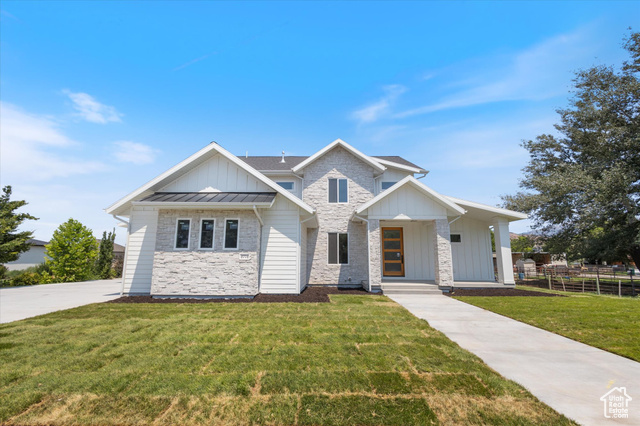 View of front of property with a front yard