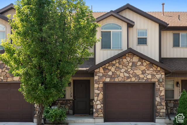 View of front of property featuring a garage