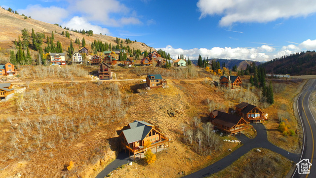 Birds eye view of property with a mountain view