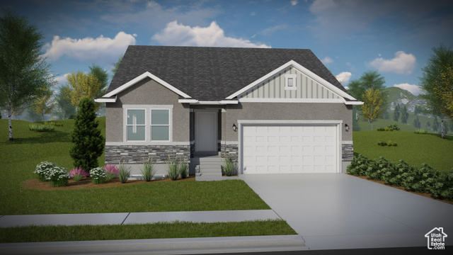 View of front of property featuring a garage and a front yard