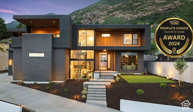 Contemporary house with a mountain view and a yard