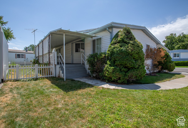 View of front of property with a front yard