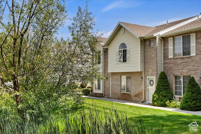 Exterior space featuring a yard