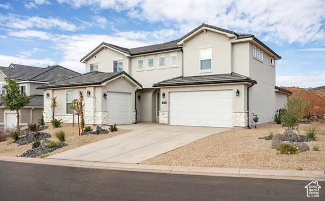 Front of property with a garage