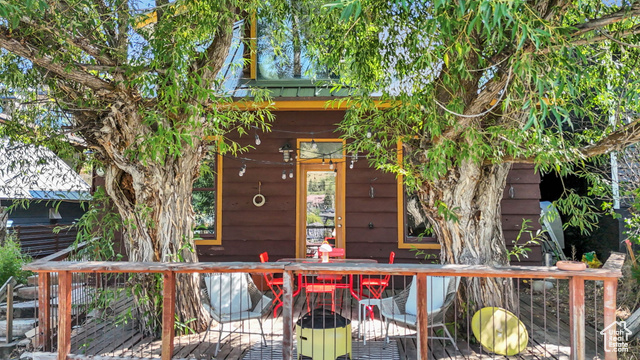 Entrance to property featuring a wooden deck