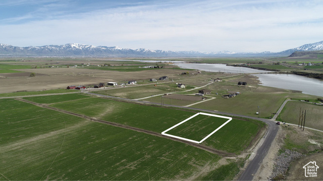 Birds eye view of property featuring a rural view and a water and mountain view