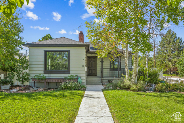 View of front of property with a front lawn