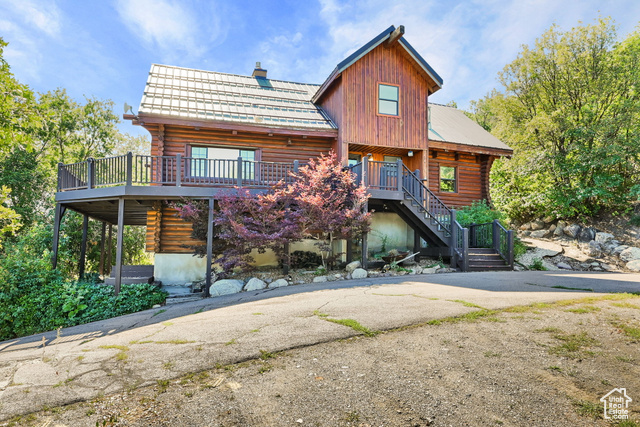 View of front of house with a deck