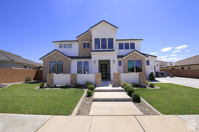 View of front of property with a front lawn