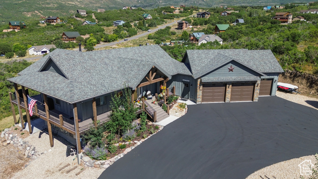 View of front of home featuring a porch and a garage