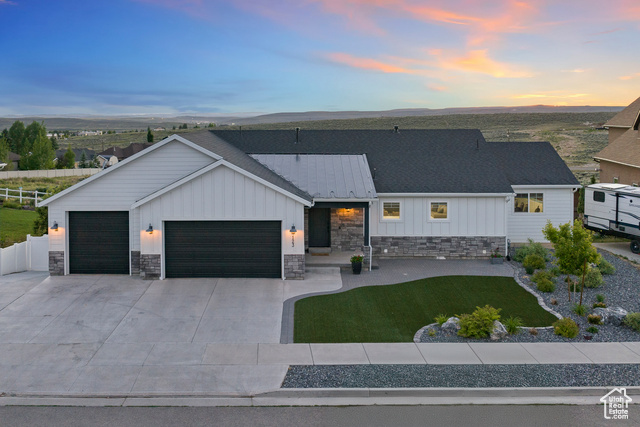 View of front of property with a garage