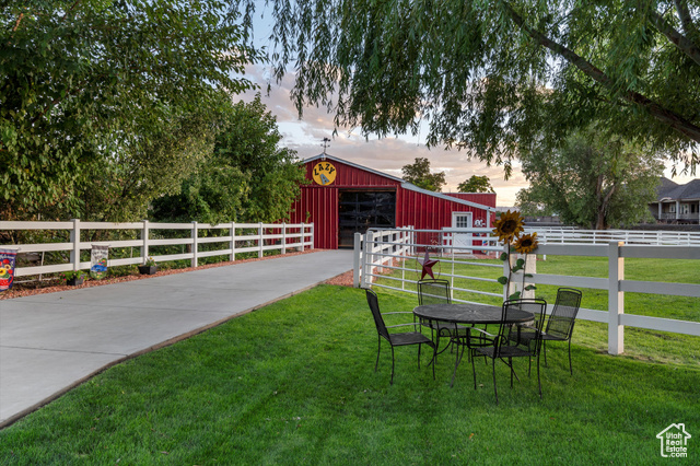 Exterior space with a lawn and an outdoor structure