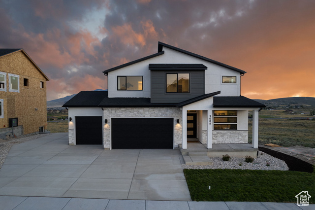 View of front of property with a garage