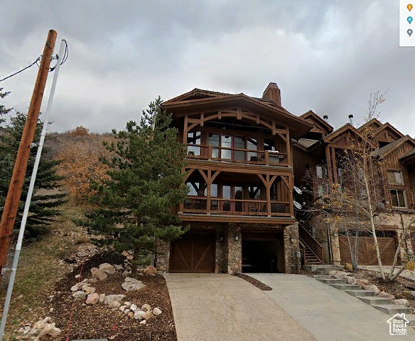 Rear view of house with a garage