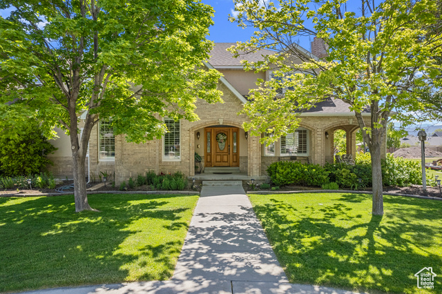 View of front of property with a front yard