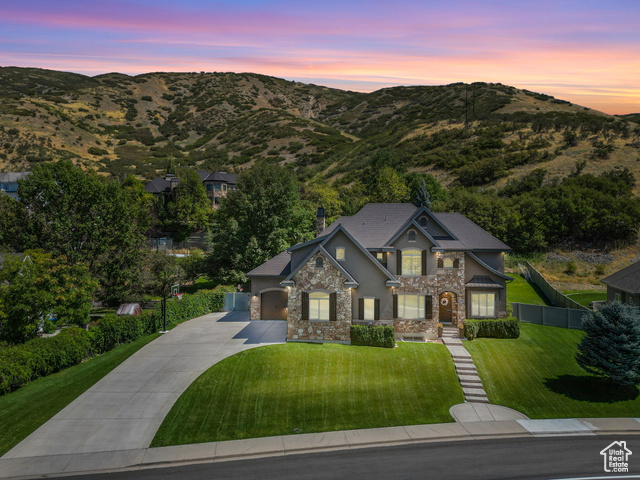 Craftsman inspired home with a yard and a mountain view