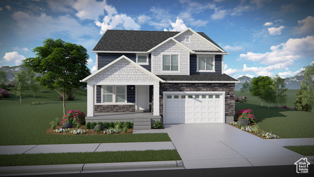 Craftsman house featuring a garage and a front lawn