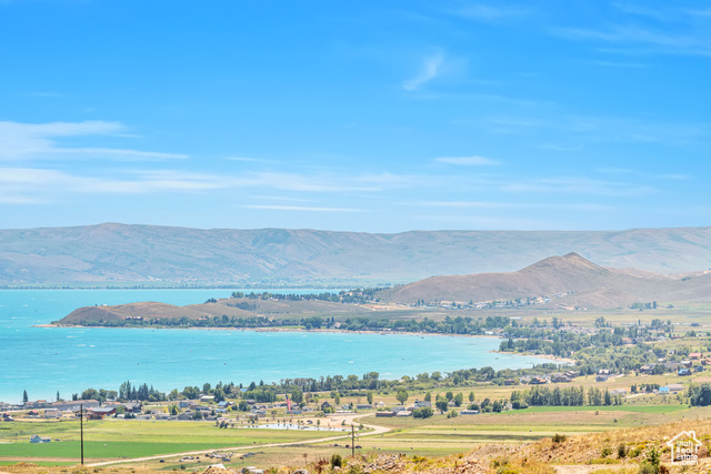 Property view of mountains with a water view