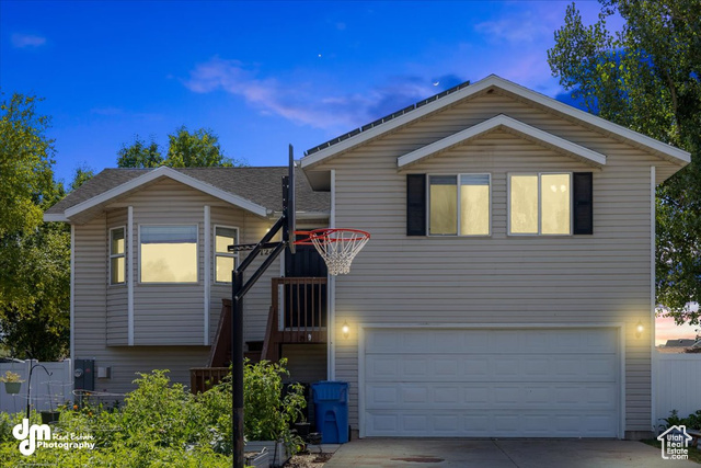 View of front of property with a garage