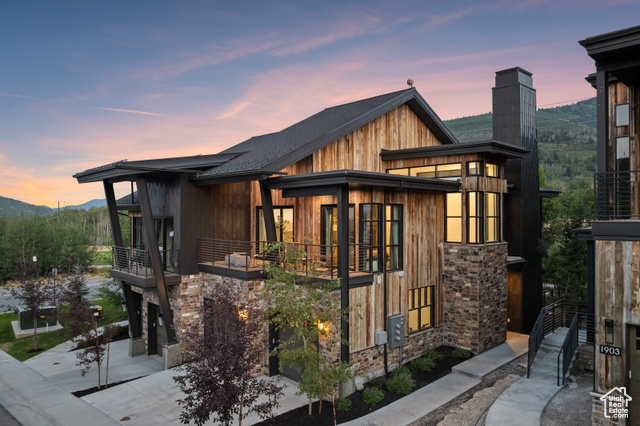 Exterior space featuring a balcony and a mountain view