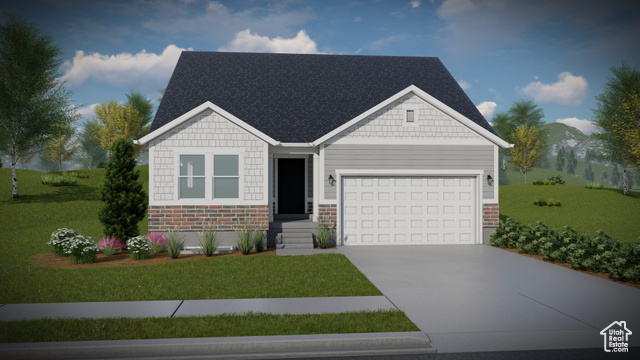 View of front of property with a front yard and a garage