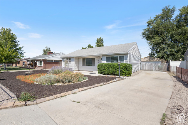 South facing Rambler style home with large 2 car detached garage.