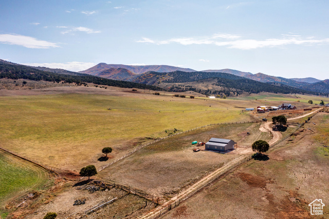 Birds eye view of property featuring a rural view and a mountain view