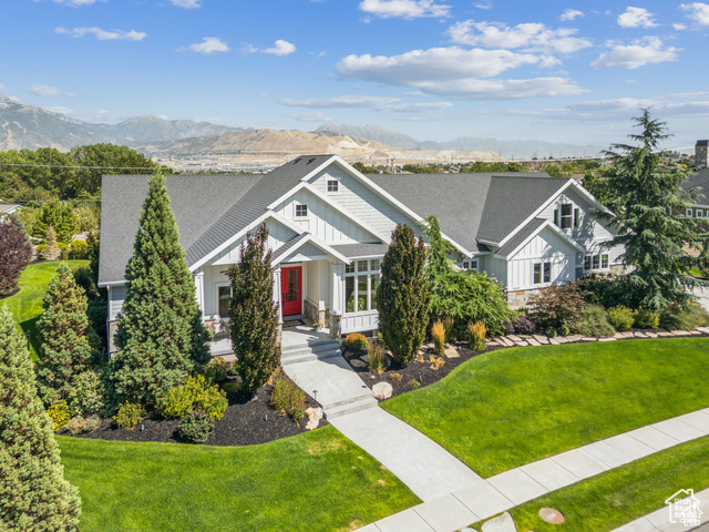 Front aerial view, front lawn and a mountain view