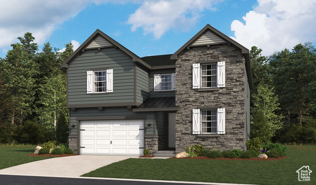 View of front of house with a garage and a front lawn