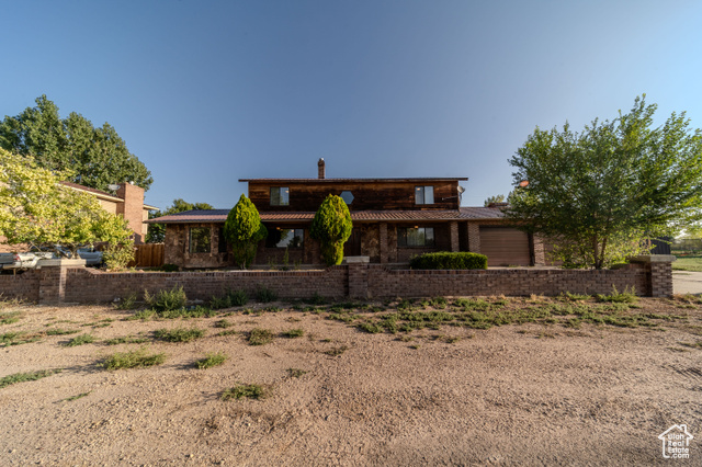 View of front of property featuring a garage