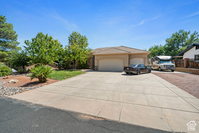 View of front facade featuring a garage