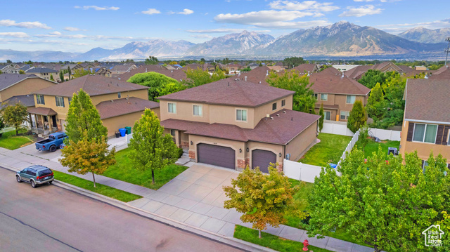 Birds eye view of property with a mountain view