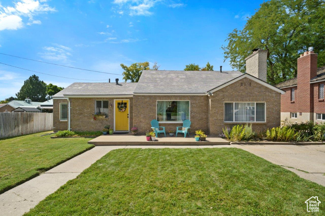 View of front of property with a front lawn