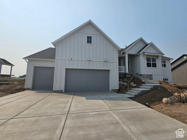 View of front of home featuring a garage