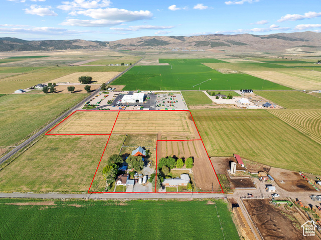 Birds eye view of property featuring a mountain view and a rural view