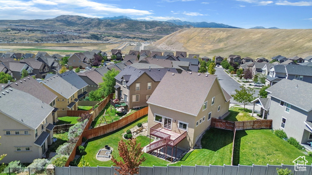 Birds eye view of property with a mountain view