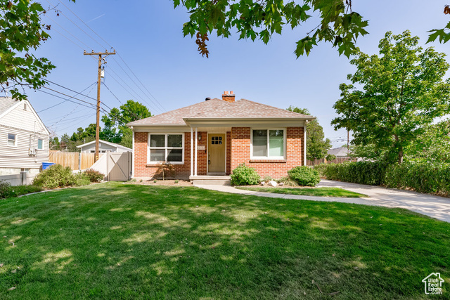 View of front of house featuring a front lawn