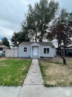 View of front of property with a front lawn