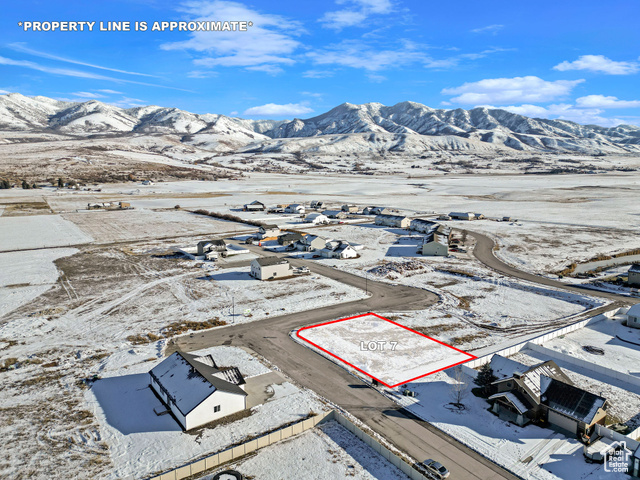 Snowy aerial view with a mountain view