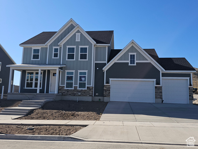 Craftsman-style house with a 5 CAR garage