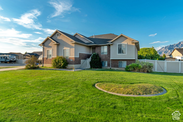 View of front of property with a front yard