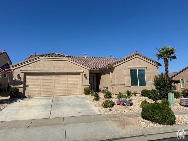 Ranch-style home featuring a garage