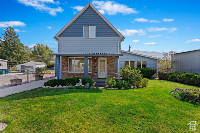 View of front of house with a front yard