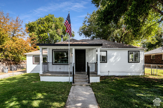 Bungalow-style home featuring a front yard and a porch