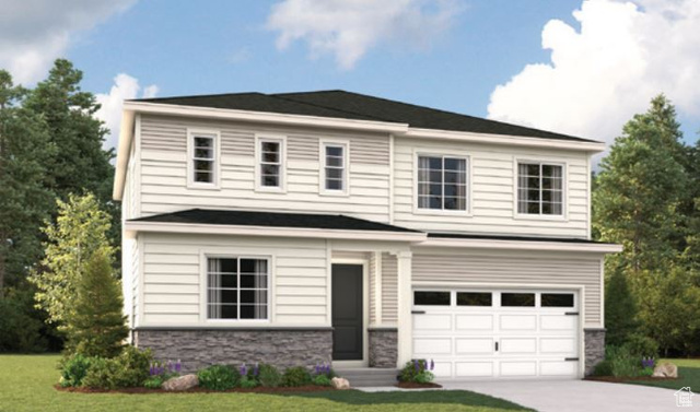 View of front facade with a garage and a front lawn